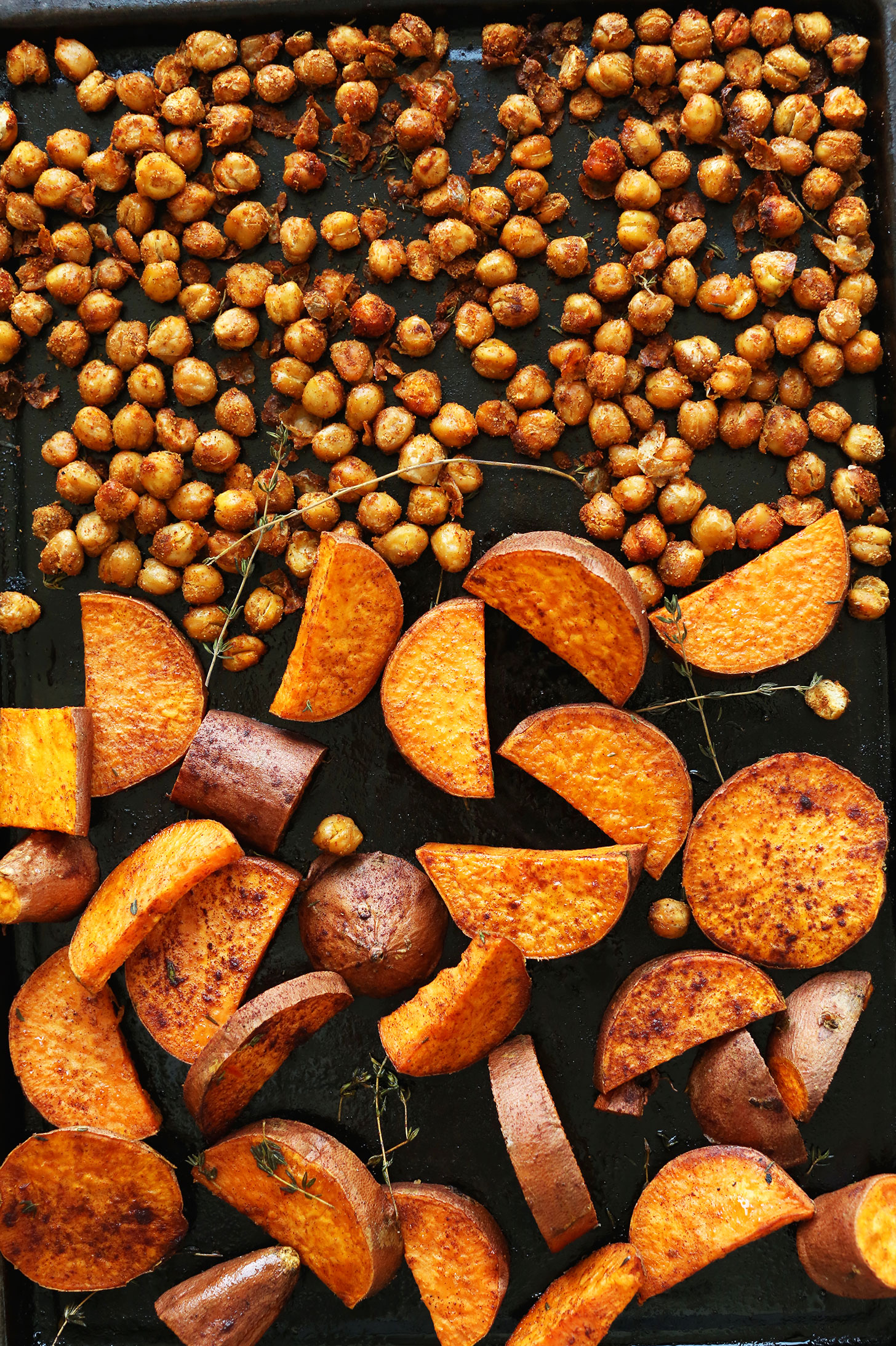 Roasting chickpeas and sweet potatoes for our vegan Fall Bounty Thanksgiving Wraps