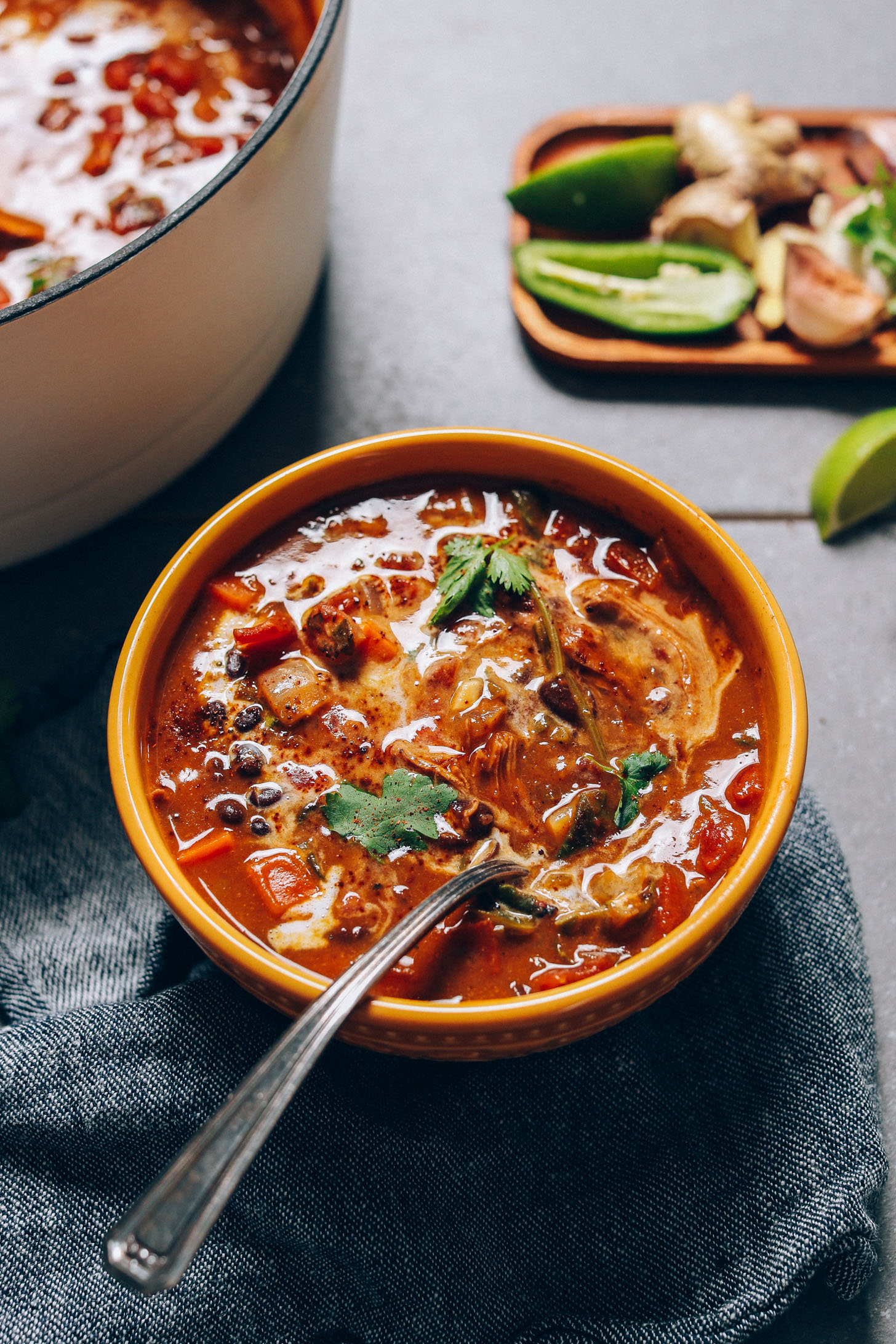 Bowl of comforting Pumpkin Black Bean Soup topped with fresh cilantro