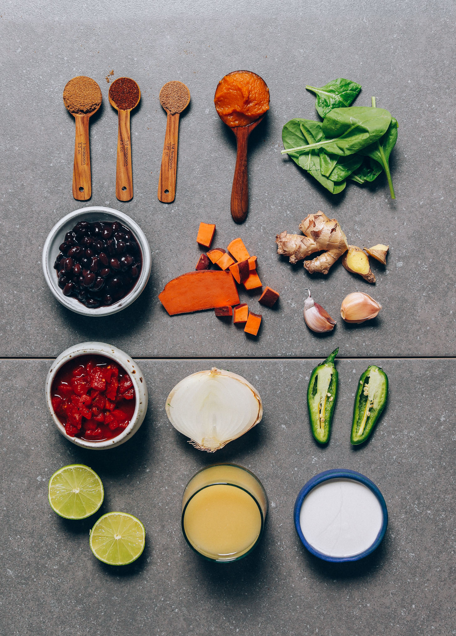 Black beans, sweet potato, onion, ginger, and other ingredients for making our simple Pumpkin Black Bean Soup recipe