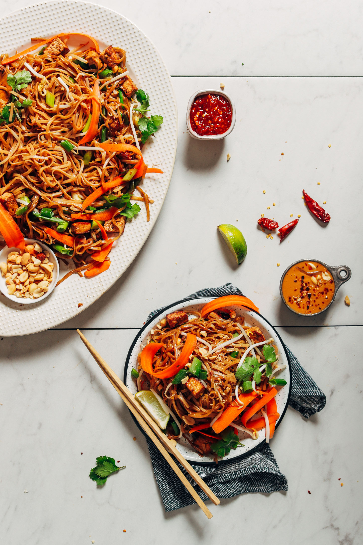 Platter and plate filled with our Easy Tofu Pad Thai recipe