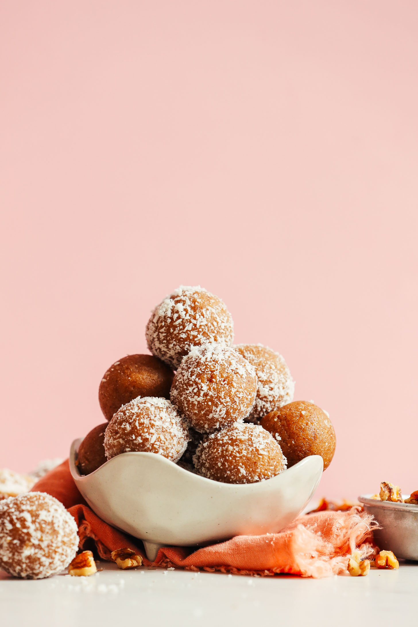 Bowl of our delicious date-sweetened vegan No Bake Vanilla Cake Bites