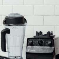 Vitamix 5200 blender in front of a tile background