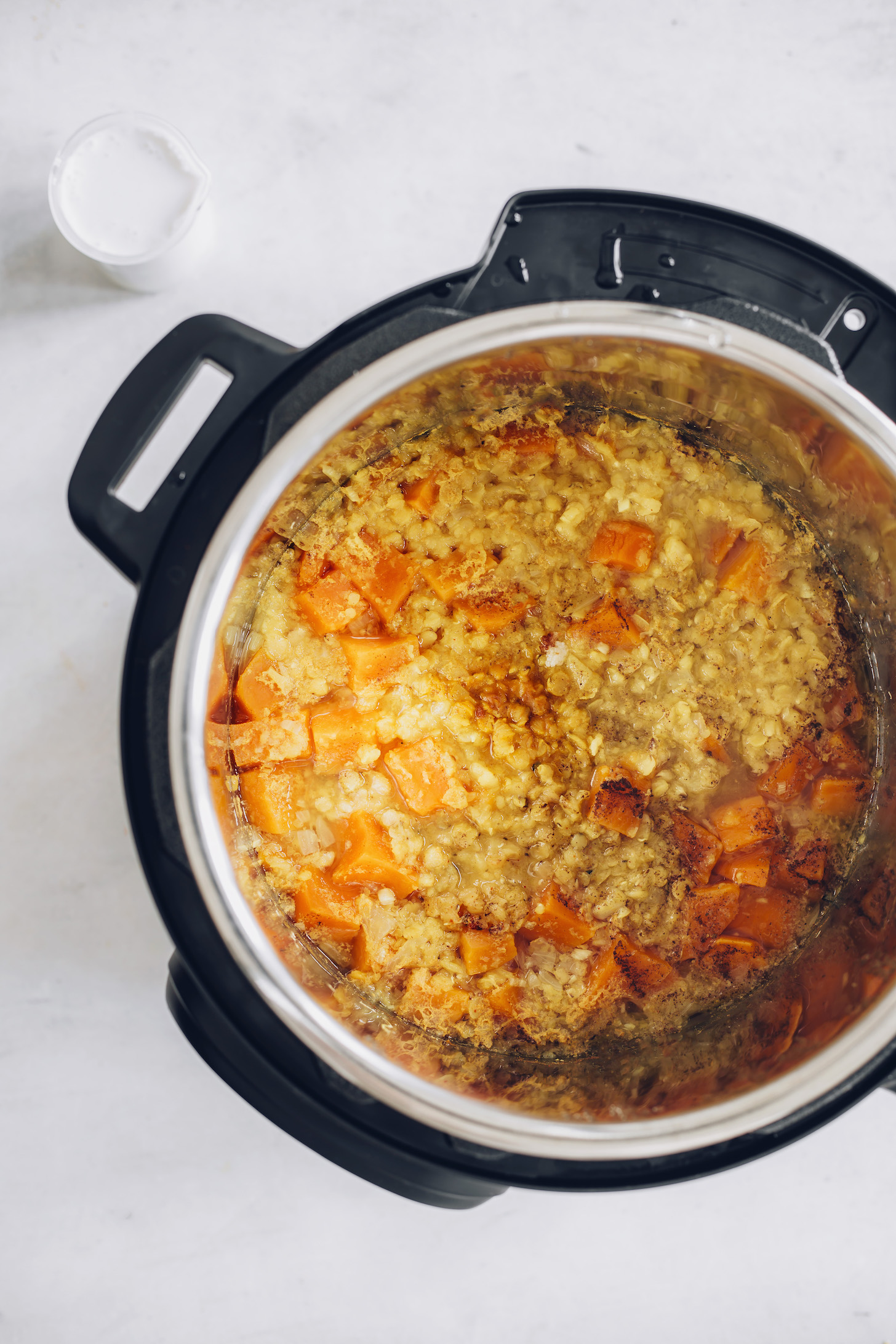 Cooked red lentils, sweet potato, and spices in an Instant Pot