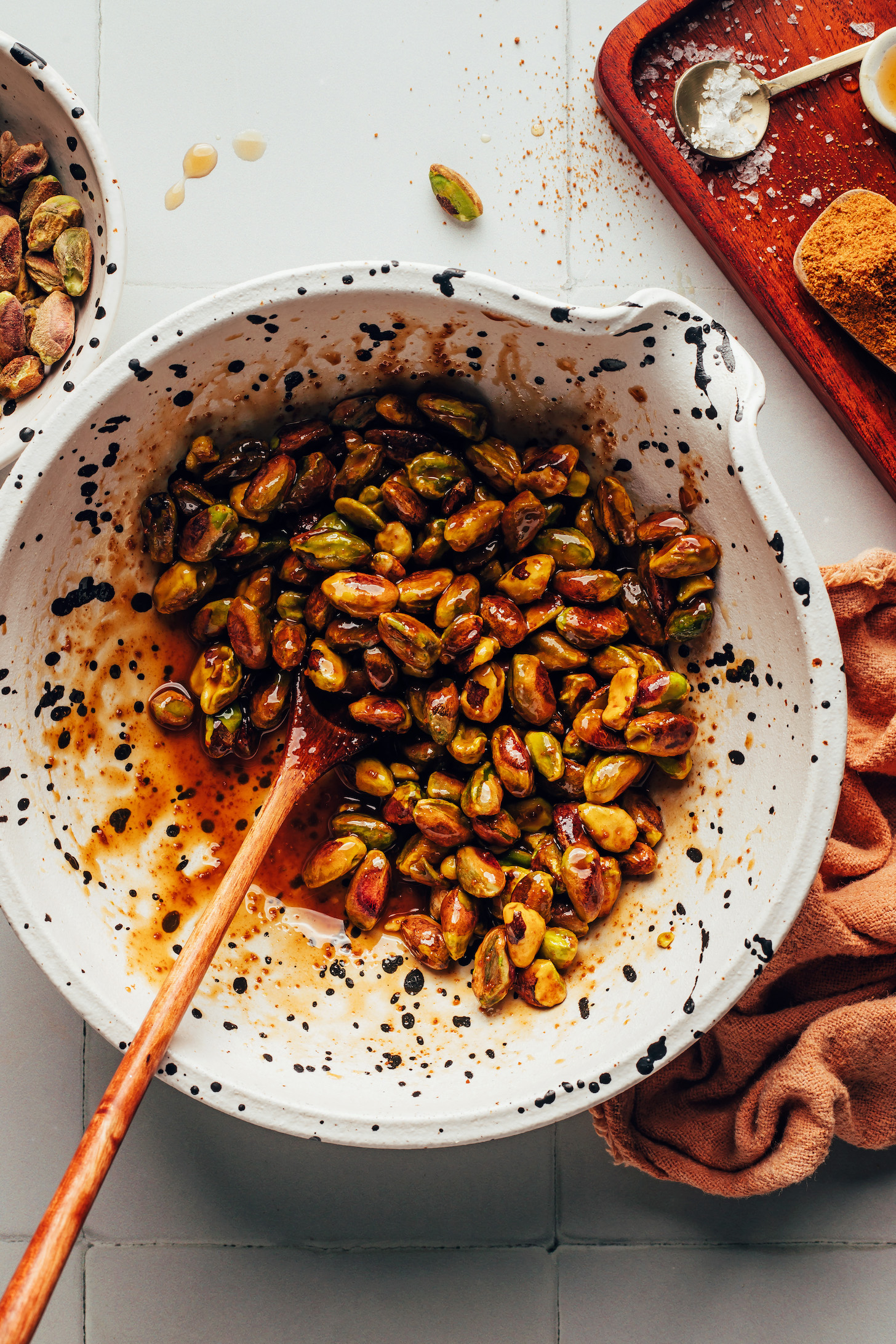 Bowl with pistachios coated in a maple syrup, coconut sugar, and vanilla glaze