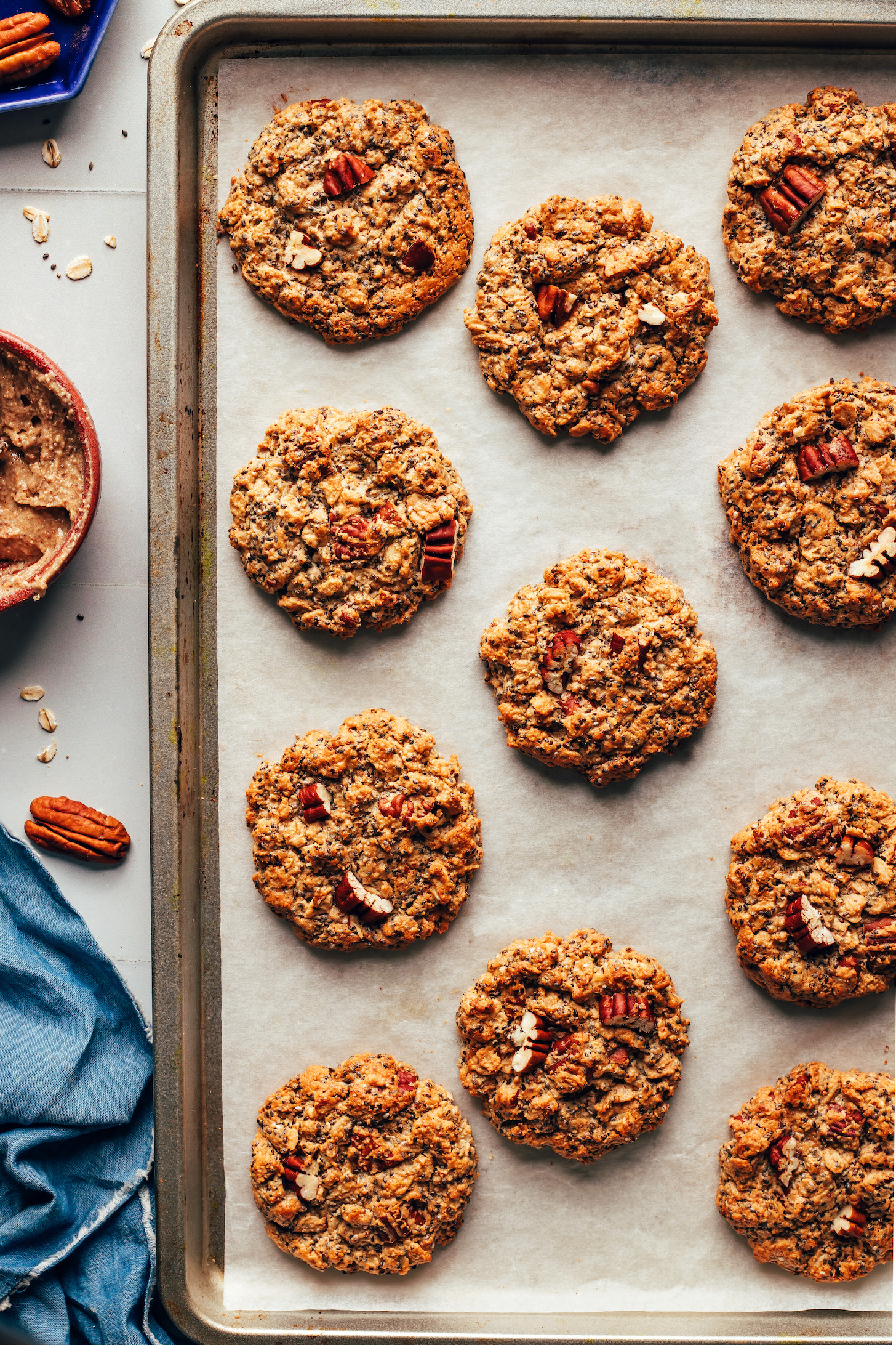 Freshly baked chai-spiced oatmeal cookies on a parchment-lined baking sheet