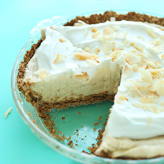 GF Vegan Coconut Cream Pie with a slice removed