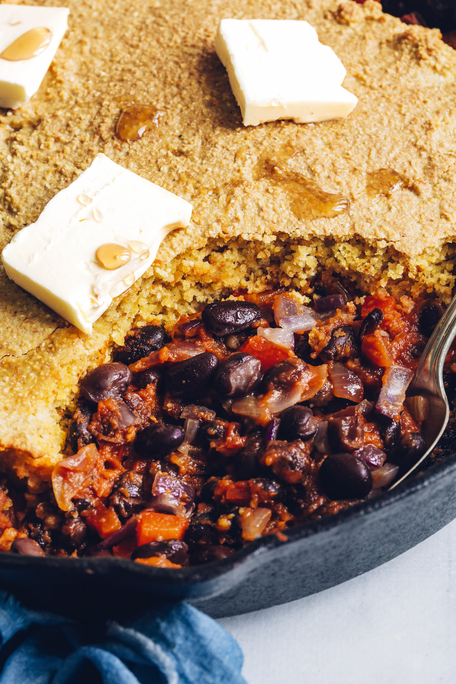 Cornbread and black bean enchilada bake with a slice removed