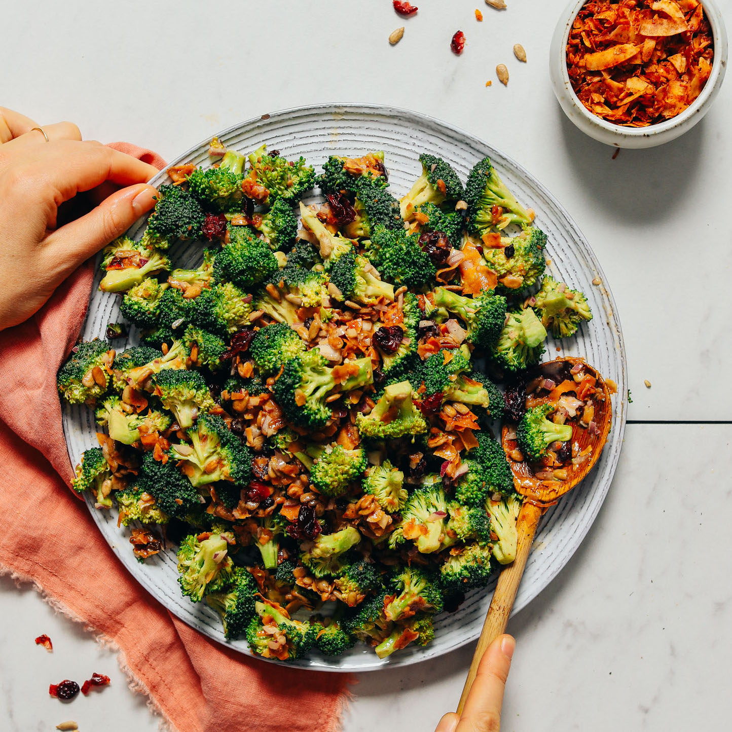 Plate of Creamy Vegan Broccoli Salad made with coconut bacon and a cashew butter dressing