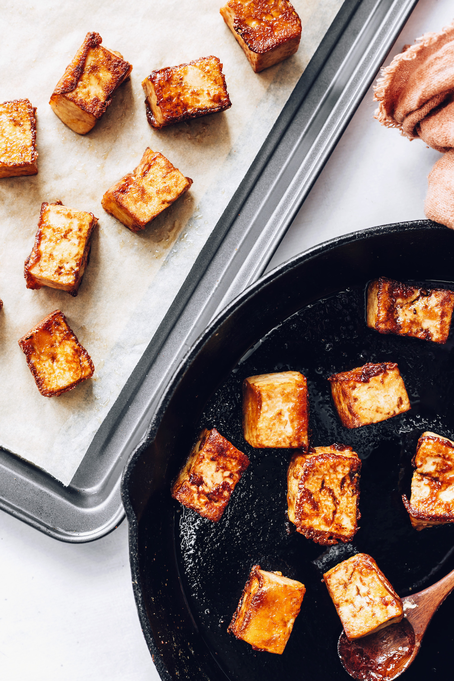 Skillet and baking sheet of crispy cubed tofu