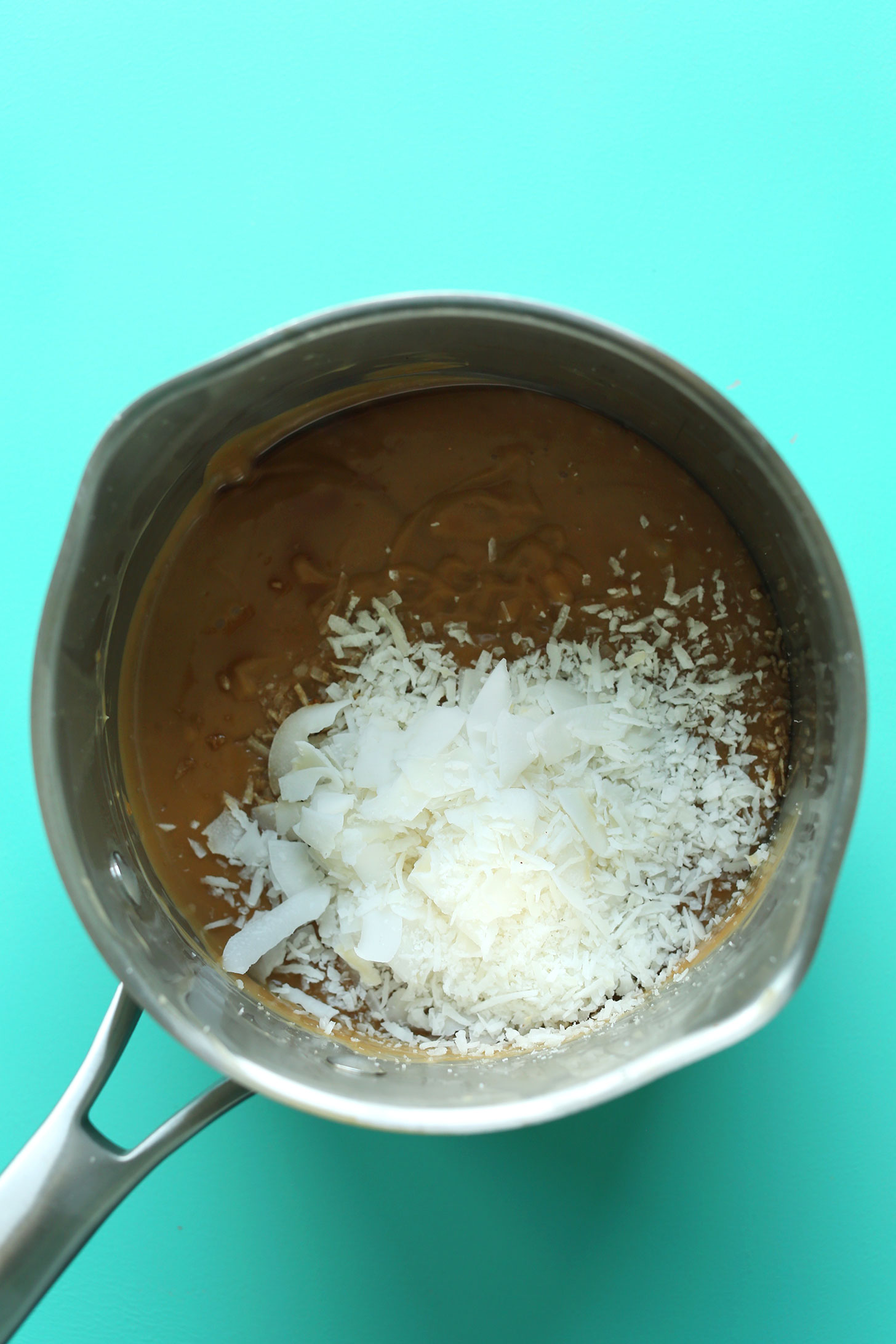 Toasting coconut in a pan for our Coconut Cream Pie recipe