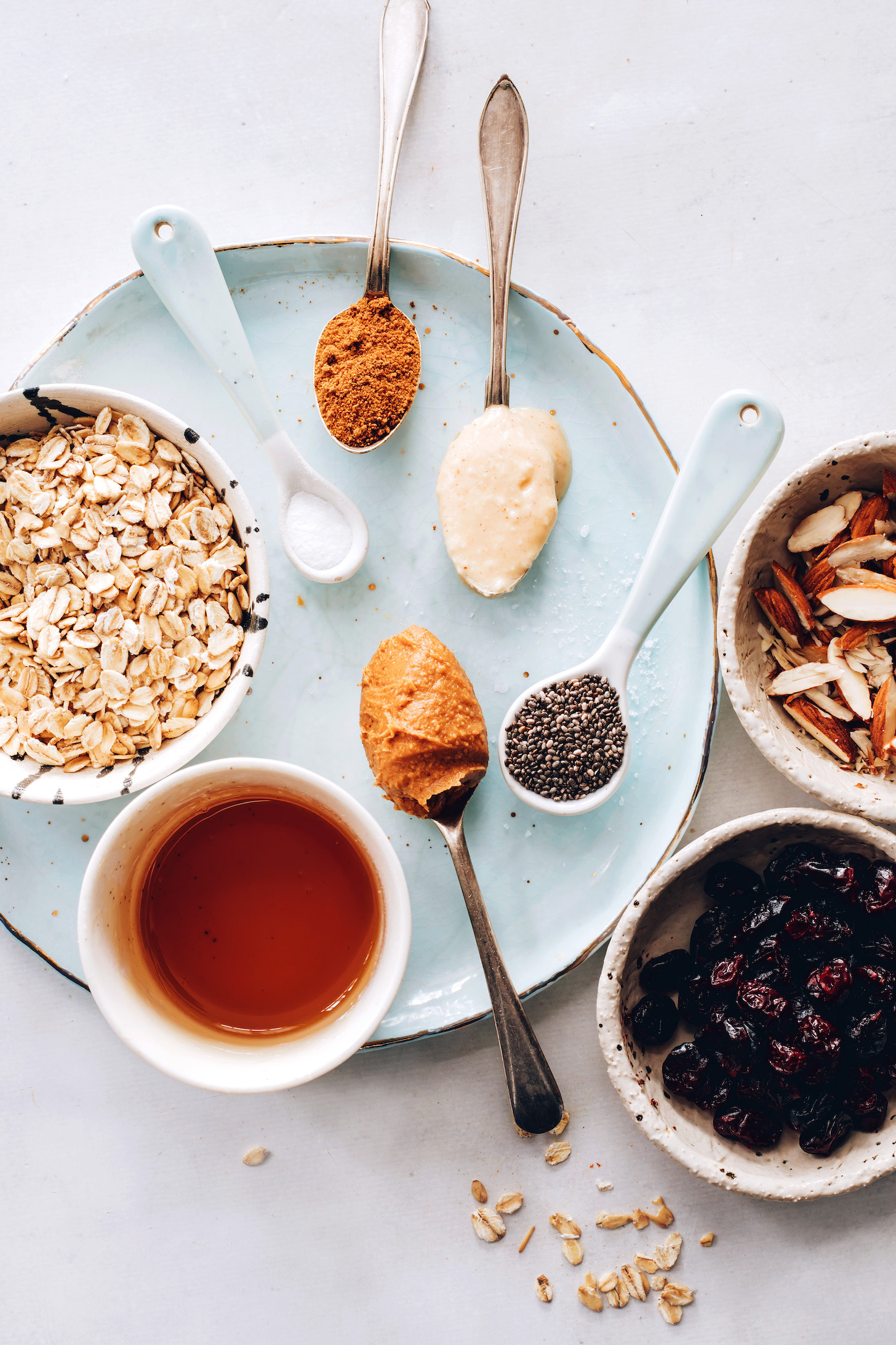 Dried cherries, almonds, chia seeds, nut butters, coconut sugar, salt, oats, and maple syrup