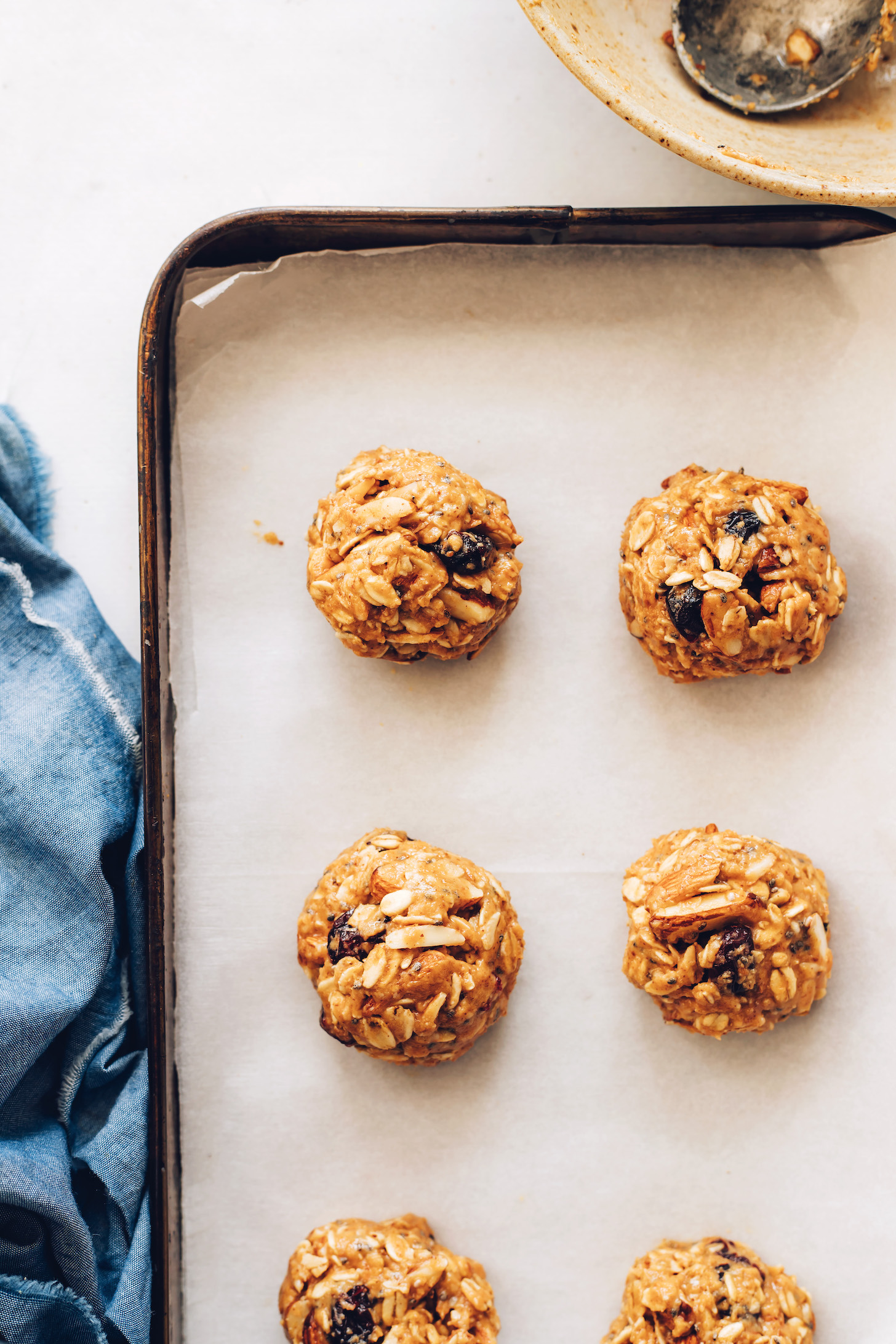 Parchment-lined baking sheet of our easy granola cookies recipe