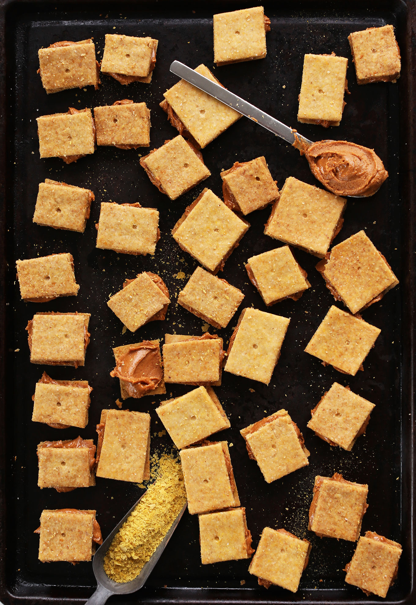 Baking sheet filled with Peanut Butter Cheese Crackers for a healthy gluten-free vegan snack