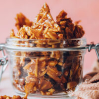 Pieces of almond brittle in a jar