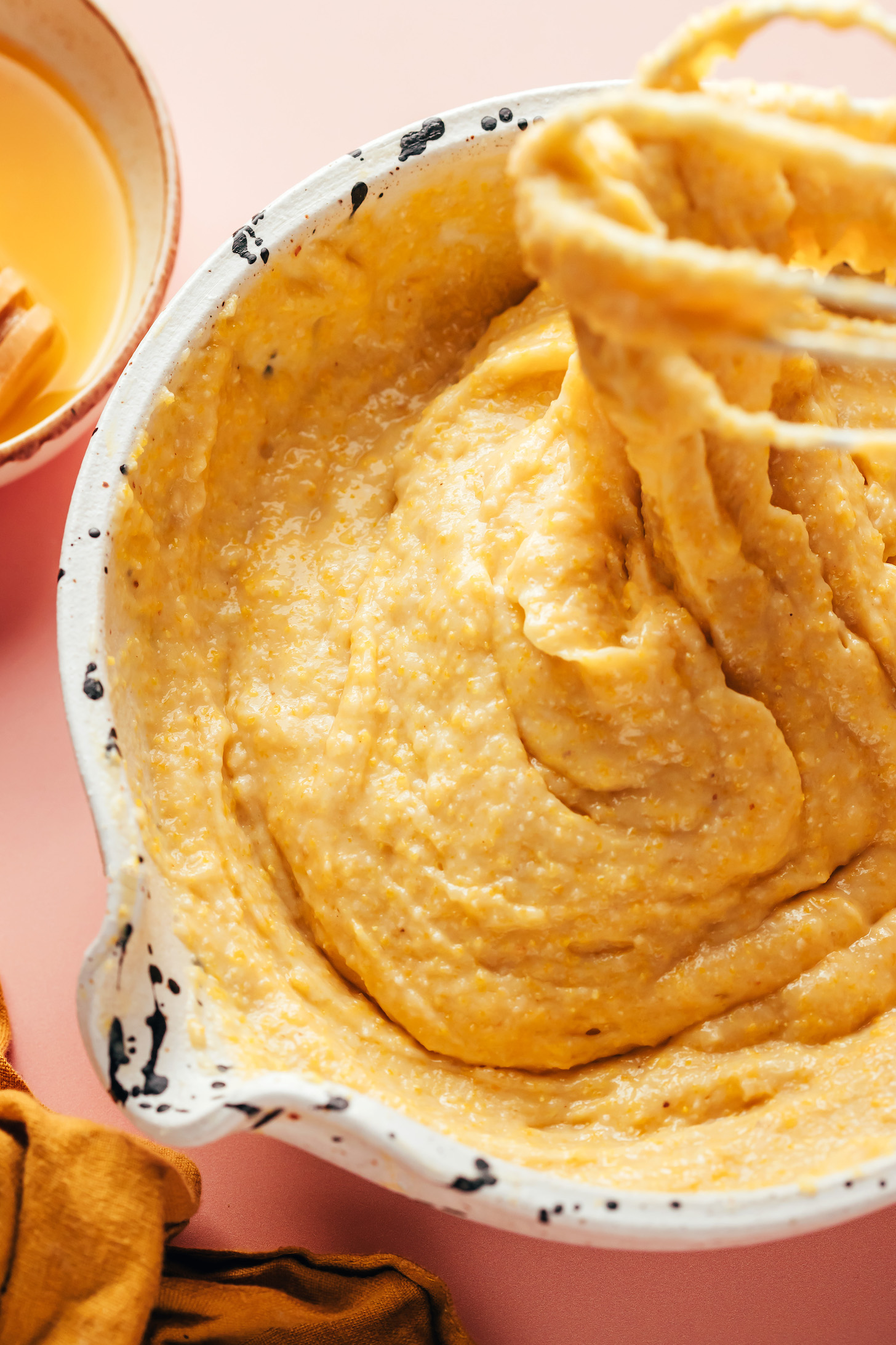 Using a whisk to mix gluten-free cornbread batter