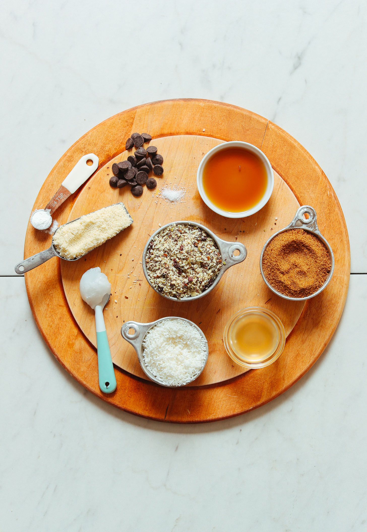 Coconut, seeds, chocolate chips and other ingredients for making vegan trail mix cookies