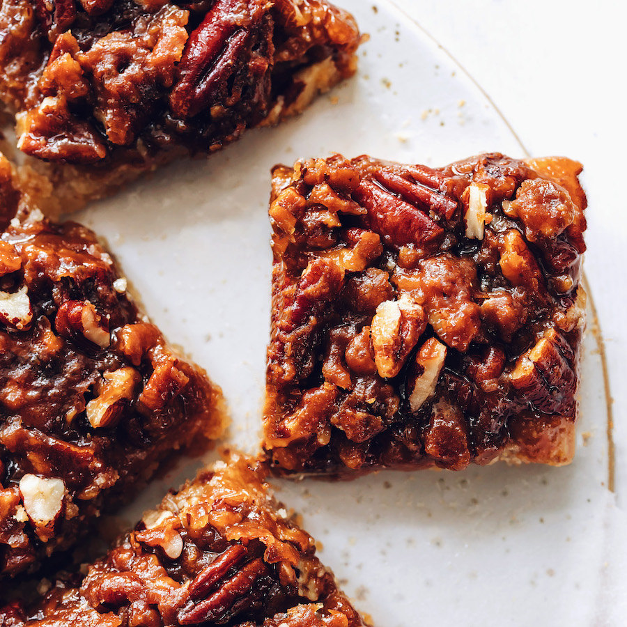 Overhead photo showing crispy pecans on pecan pie bars