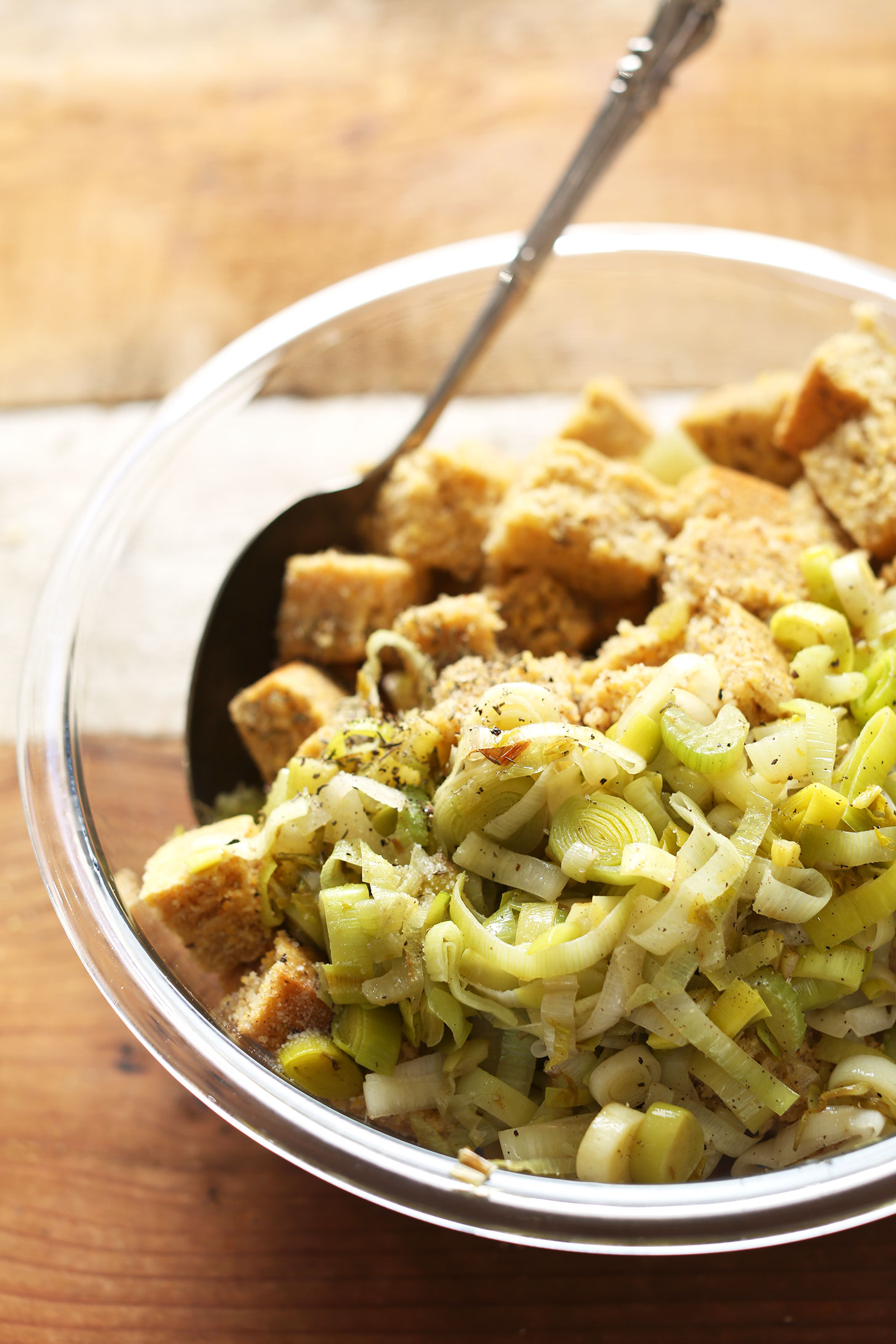 A bowl full of leeks and cornbread for making Vegan Gluten-Free Cornbread Stuffing