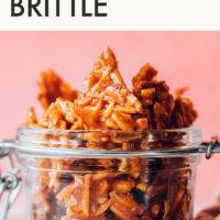 Jar of easy vegan and gluten-free almond brittle