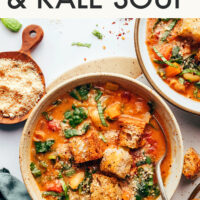 Overhead shot of two bowls of creamy Tuscan white bean and kale soup