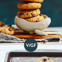 Baking sheet and bowl of Grain-Free Vegan Trail Mix Cookies