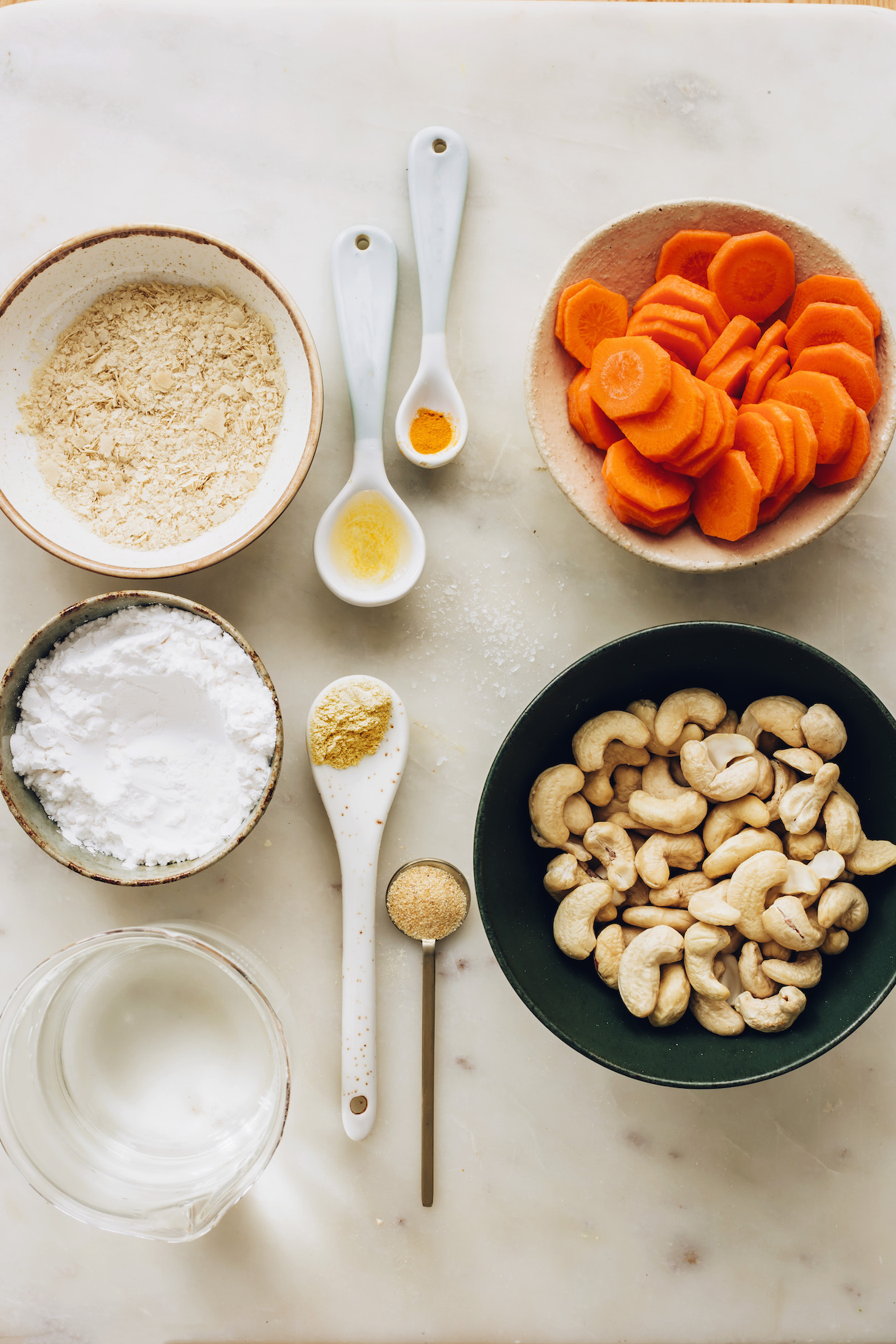 Nutritional yeast, tapioca starch, water, spices, cashews, and carrots