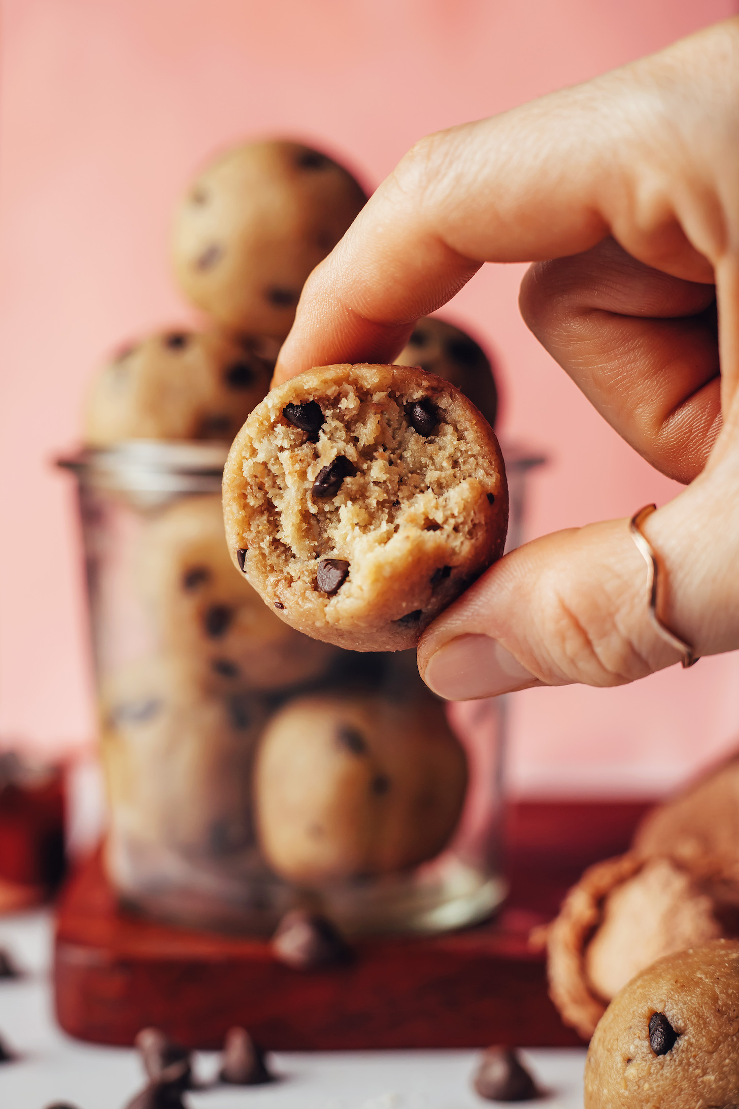 Holding up a half eaten cookie dough bite to show the inner texture