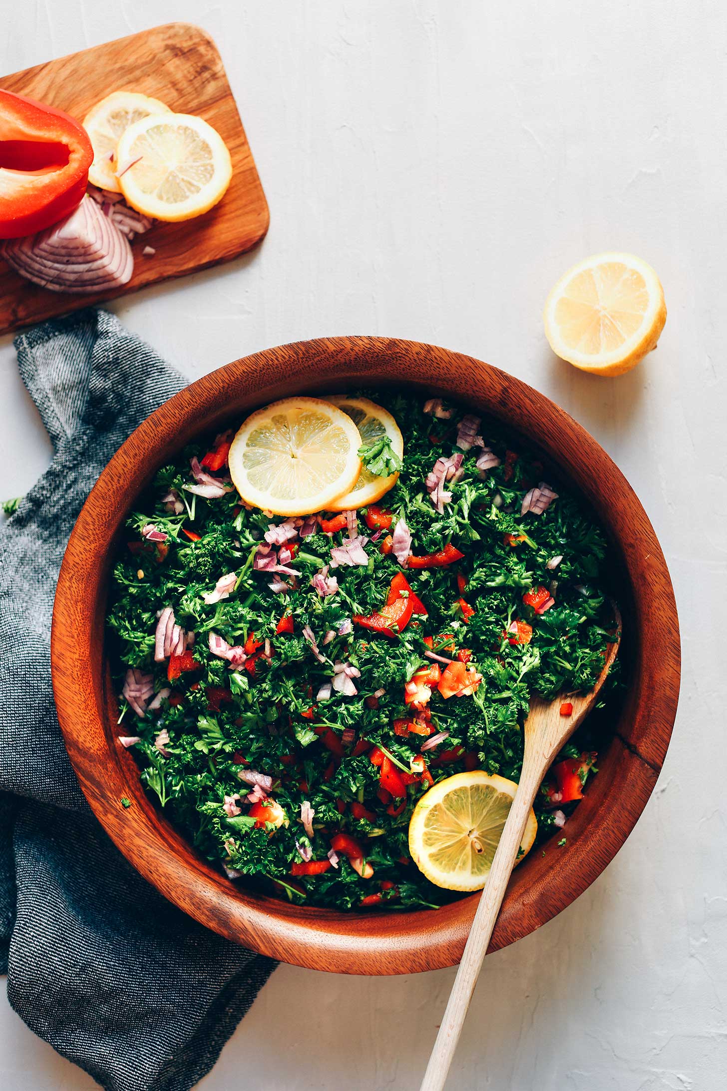 Wood salad bowl filled with our flavorful Grain-Free Tabbouleh Salad