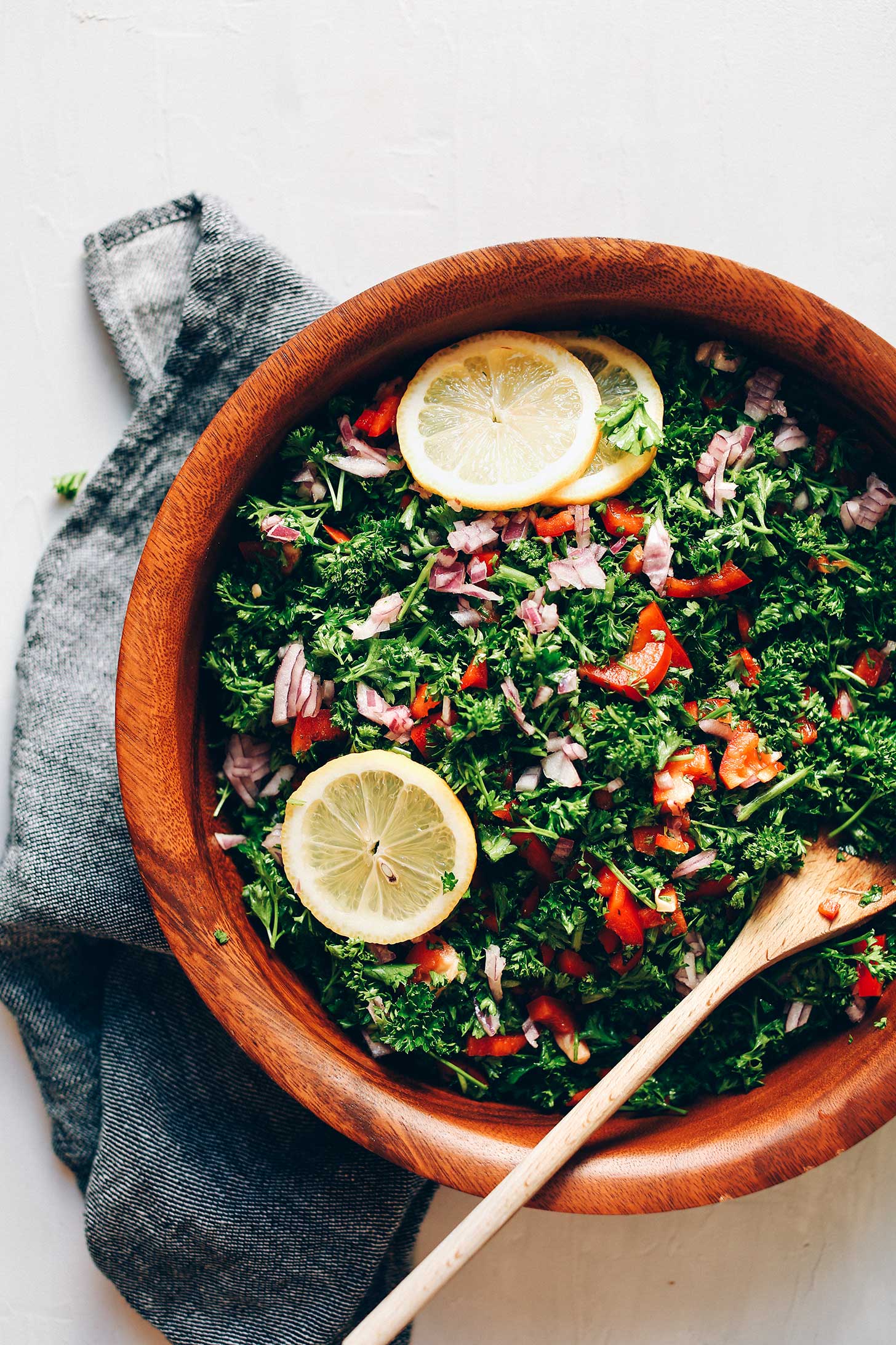 Wood bowl filled with vegan Grain-Free Tabbouleh Salad