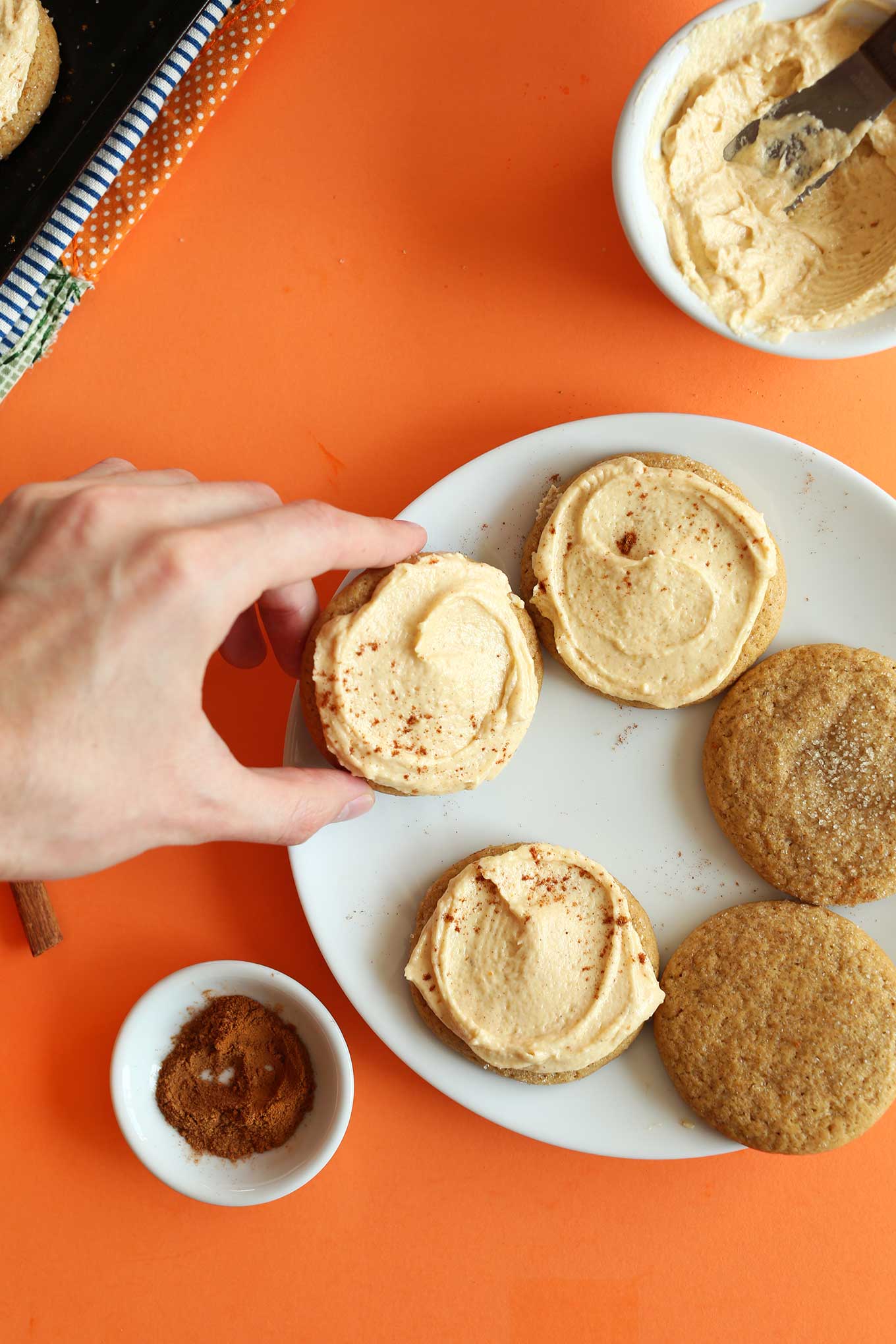 Grabbing a freshly frosted Vegan Pumpkin Sugar Cookie