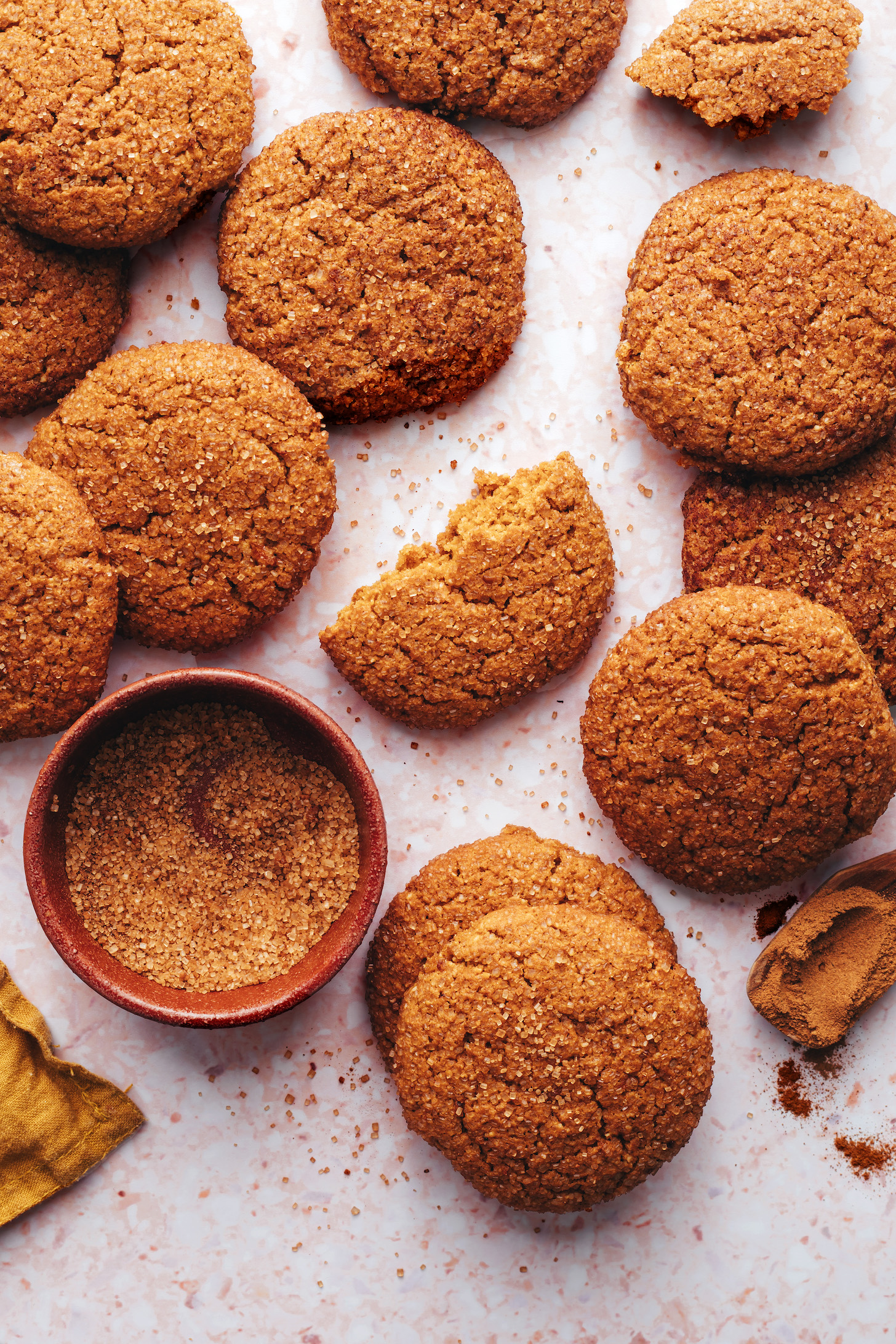 Bowl of pumpkin spice sugar next to pumpkin snickerdoodle cookies