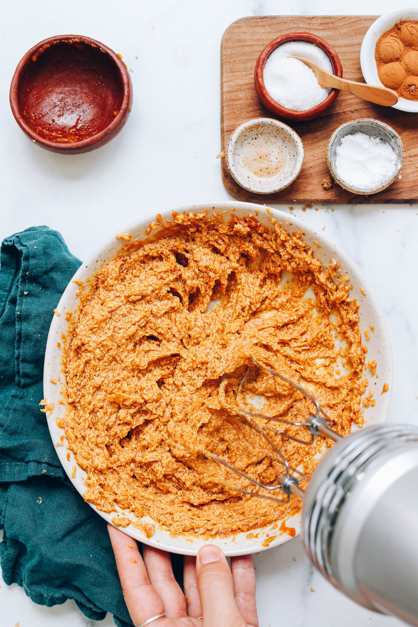 Using a hand mixer to combine wet ingredients