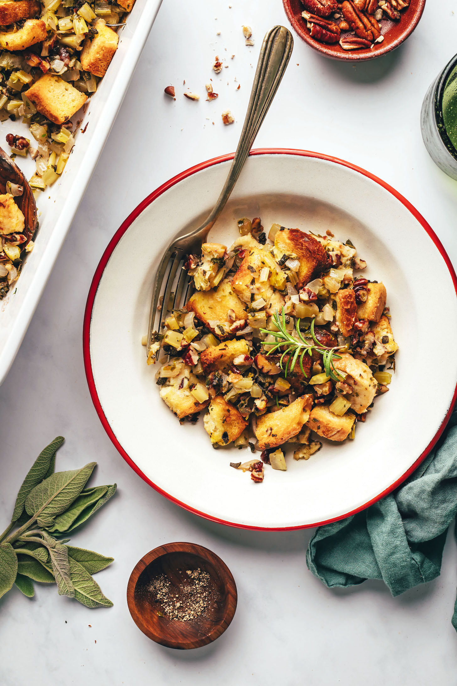 Plate and baking dish of gluten-free vegan stuffing