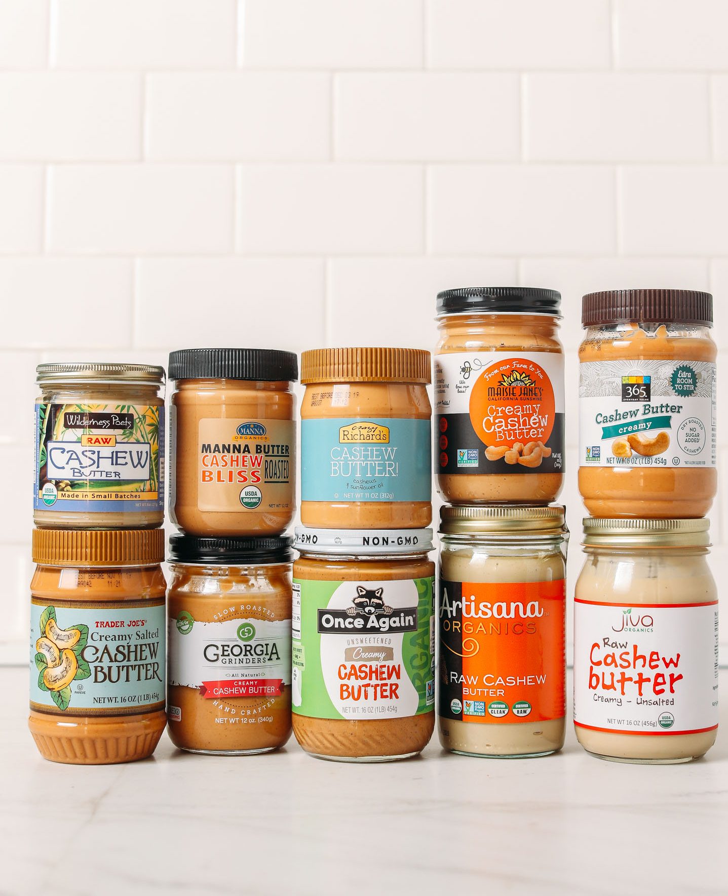 Jars of various brands of cashew butter for our unbiased review