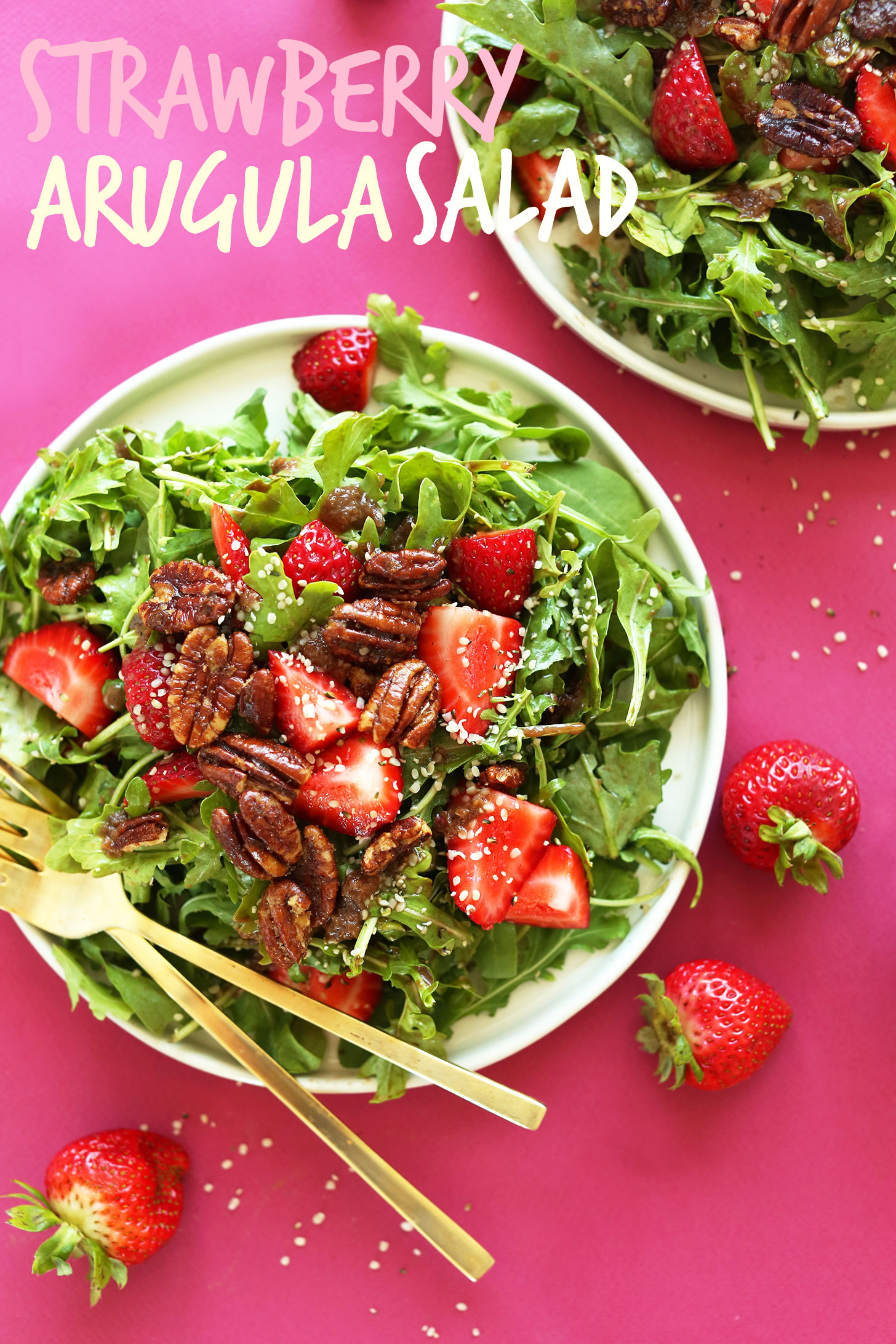 Big plate of vegan Strawberry Arugula Salad with Brown Sugar Pecans and Warm Shallot Vinaigrette