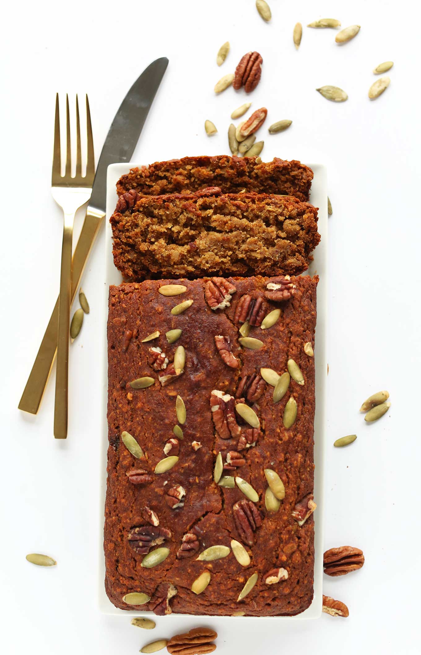 Partially sliced loaf of the best Vegan Gluten-Free Pumpkin Bread