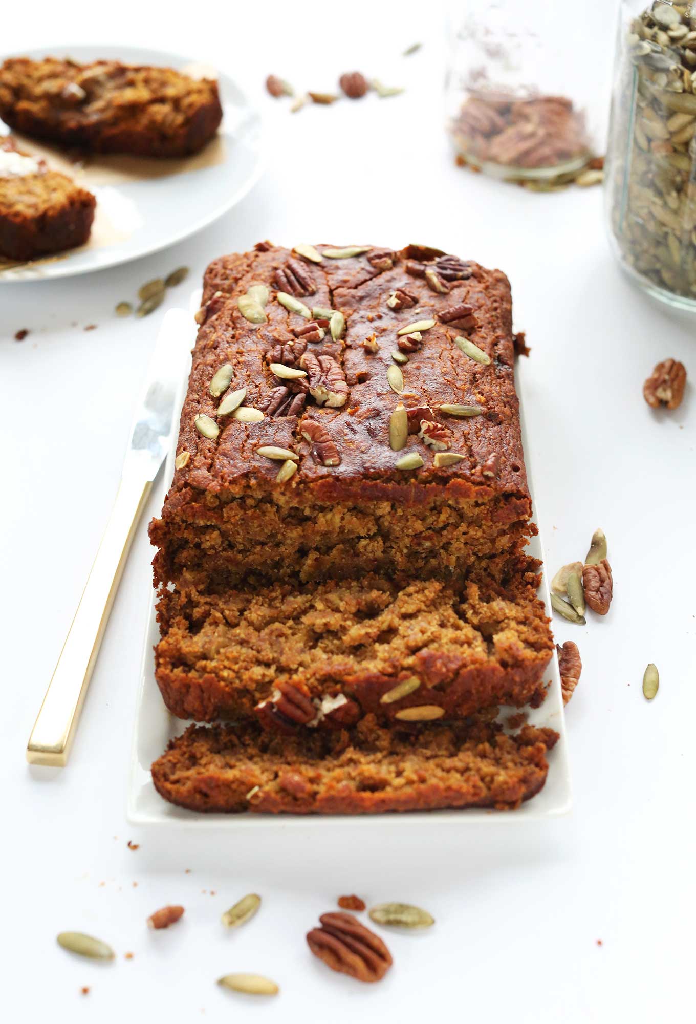 Partially sliced loaf of moist and delicious 1-Bowl GF Pumpkin Bread