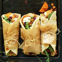 Tray with three Thanksgiving Wraps tied with parchment paper and twine