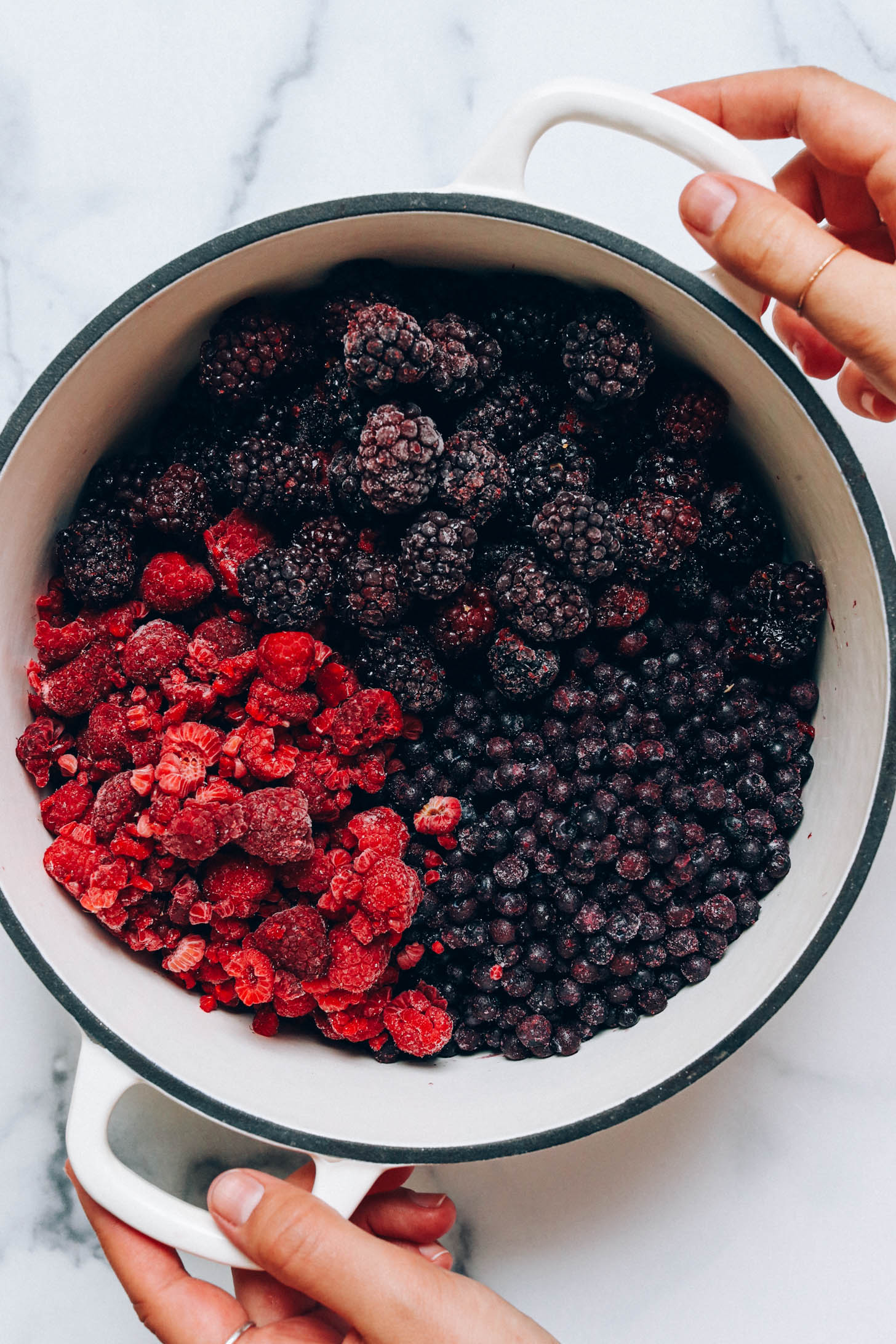 Frozen blackberries, raspberries, and blueberries in a Dutch oven