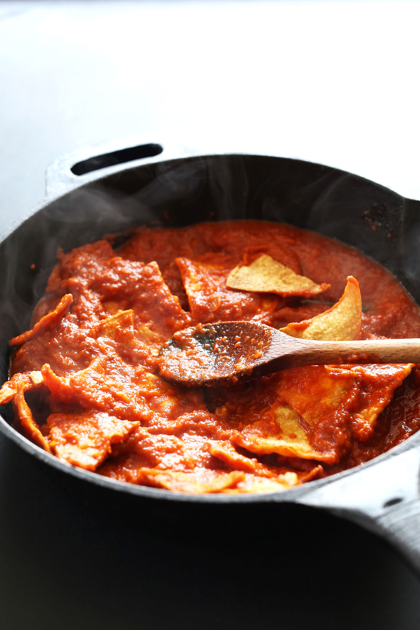 Making Tofu Chilaquiles in a cast-iron skillet 