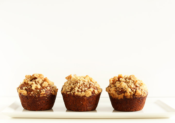 Three Vegan Banana Crumble Muffins on a white plate