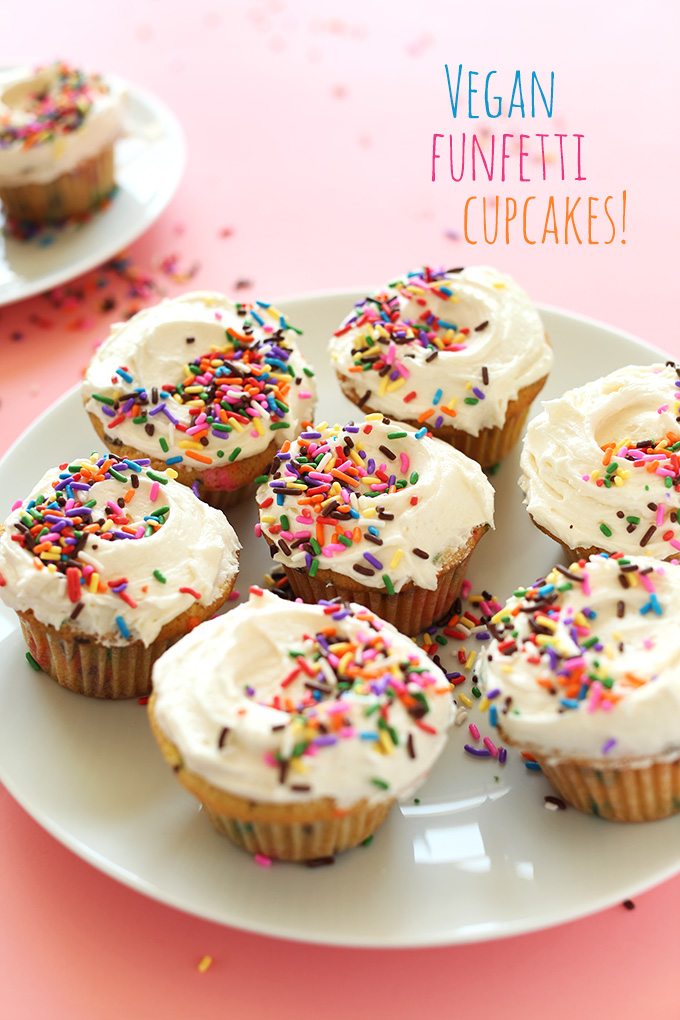 Plate of Vegan Funfetti Cupcakes with frosting and rainbow sprinkles