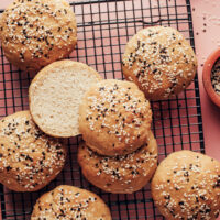 Homemade vegan gluten-free hamburger buns on a cooling rack