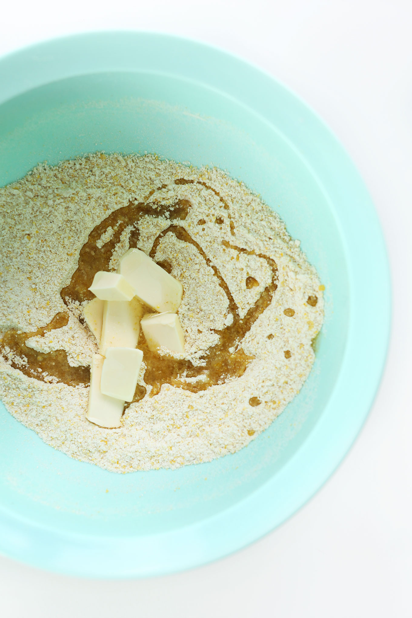 Mixing bowl with ingredients for making gluten-free cheese crackers